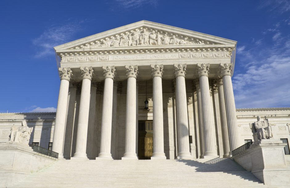 Picture of the Supreme Court building during the day.